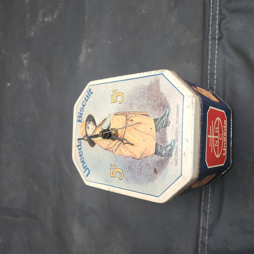 Antique Nabisco Uneeda Bicuit tin clock